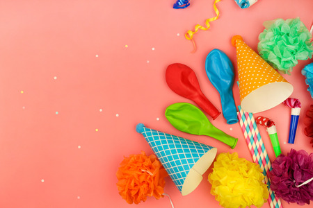 Holiday hats, whistles, balloons on pink background. Concept of children's birthday party.の写真素材