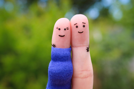 Fingers art of happy couple. Woman is pregnant.の写真素材
