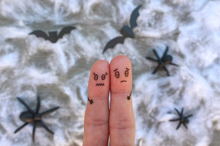 Fingers art of couple. Man and woman experience fear.の写真素材