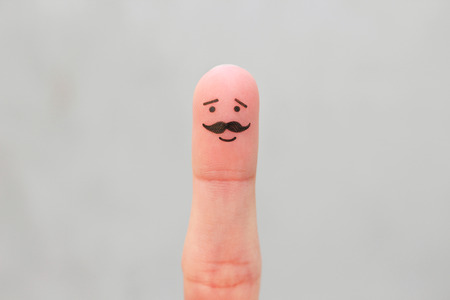Finger art of happy man with a mustache.の写真素材