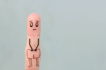 Finger art of sad man. Concept of impotence.の写真素材