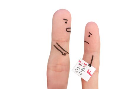 Fingers art of people. Concept of boy got a bad grade, man scolding child.の写真素材