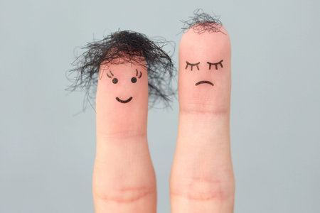 Fingers art of people. One woman is upset because she doesn't have much hair.の写真素材
