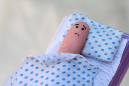 Finger art of lonely man sleeping alone in bed. Concept of loneliness.