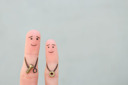 Fingers art of happy family. Concept father teaches son to repair.