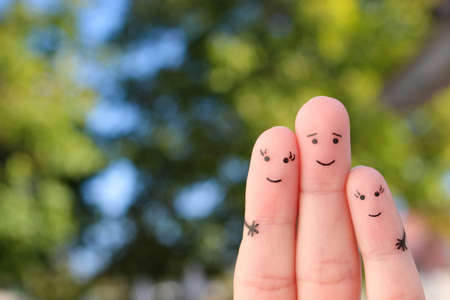 Finger art of happy family. The concept of a walk in the summer park.の写真素材