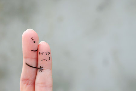 Fingers art of mother comforts her daughter.の写真素材