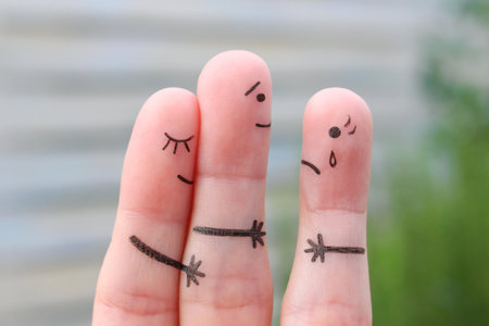 Finger art of happy couple. A man loves another woman. The concept of unrequited love.の写真素材