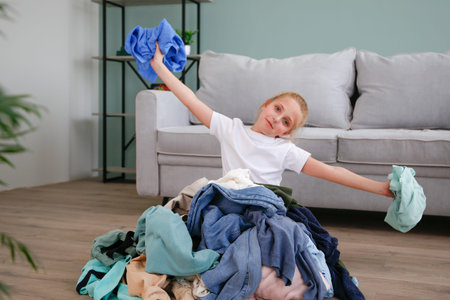 Pile of carelessly scattered clothes on the floor.