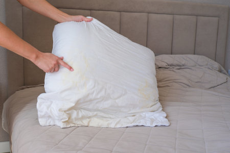 A white pillow with yellow spots.の写真素材