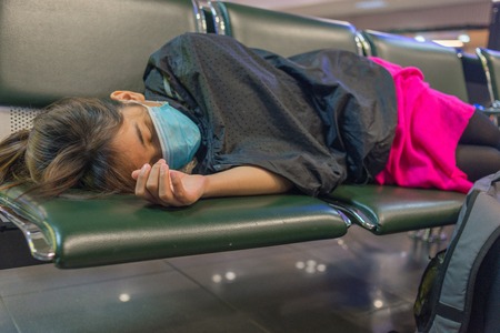 Tired of waiting for flight in departure loungeの写真素材