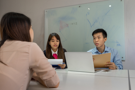 Interviewer asking candidate about her working experienceの写真素材