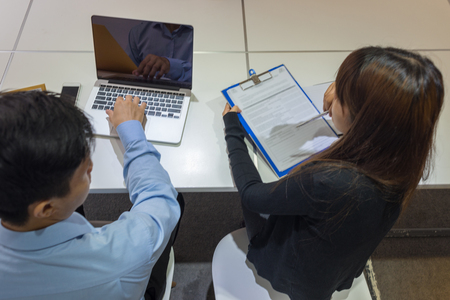 Business people read new contract and discussの写真素材