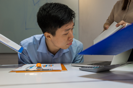 Overstressed employee feels frustrated and tiredの写真素材