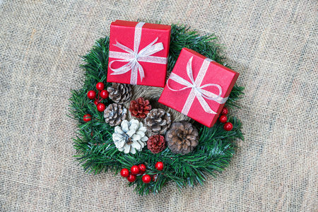 Christmas gift boxes on the Christmas wreathの写真素材