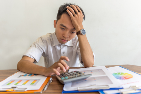 Young business employee worried about financial problemsの写真素材