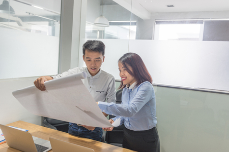 Business people discussing about the new business plan research paperの写真素材