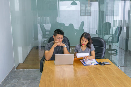 Business people discuss about financial document in the office