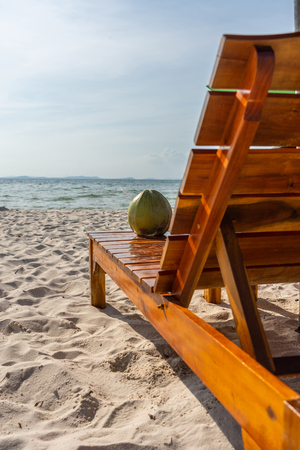 Vertical photo of tropical coconut on the chairの写真素材