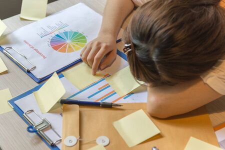Close up of businesswoman sleeping tired and exhaustedの写真素材