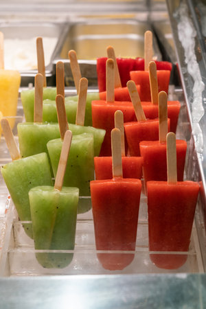 Yummy kiwi and strawberry ice pop in freezer
