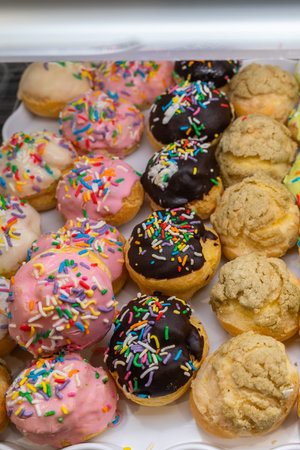 Close up photo of colorful creamy choux pastry at patisserie