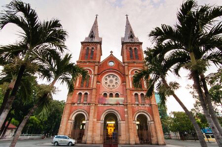 Notre Dame Cathedral Basilica of Saigon under cloudy skyの写真素材