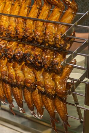 Closeup photo of crispy roasted chicken wings at Chinese restaurantの写真素材