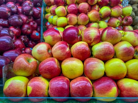 Assortment of fresh apples for sale at fruit marketの写真素材