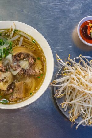 Vertical photo of traditional Vietnamese soup noodles - Phoの写真素材