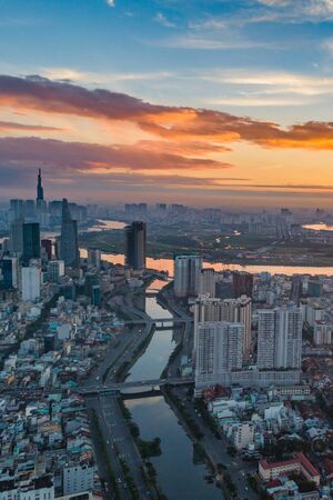 Vertical cityscape photo of Ho Chi Minh city at sunsetの写真素材