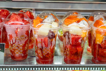 Mixed fruit cups for sale displayed at dessert restaurant's showcase
