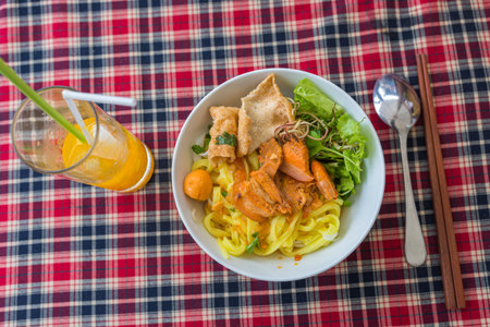 Vietnamese famous cuisine- Mi Quang rice noodles soup and vegetables