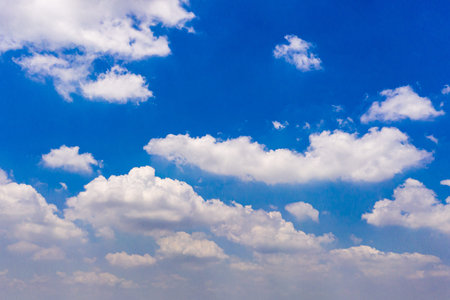 White clouds cumulus floating on blue sky for backgrounds concept