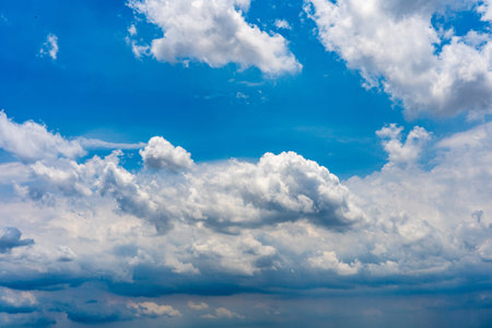 Dramatic cloudy sky background with white clouds floating