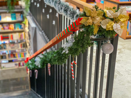 Stairs handrail with snowy garland and baubles for Christmas decorationの写真素材