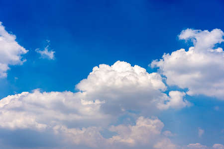Natural cloudscape with vast blue sky and cumulus white cloudの写真素材