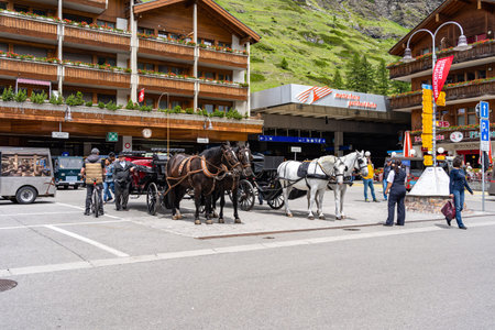 ZERMATT, SWITZERLAND - JUNE 22, 2019: Horse carriage vehicle for tourists in Zermatt town, Switzerland in summerのeditorial素材