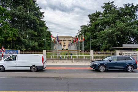 GENEVA, SWITZERLAND - JUNE 21, 2019: The United Nation headquarters office and national flags at the entranceのeditorial素材