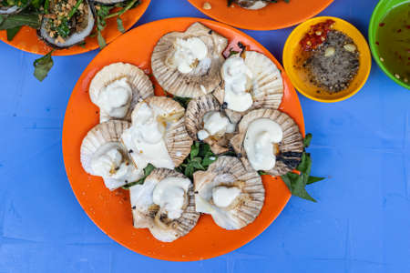 Vietnam styled grilled scallops and creamy cheese on the topの写真素材