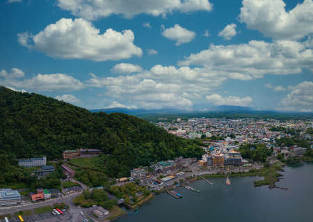 Kawaguchi lake and lakeside townscape under summer blue skyの写真素材