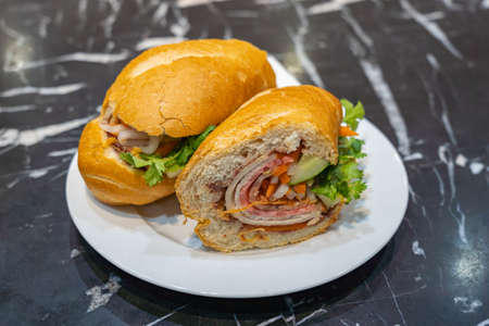 Vietnamese cuisine - Banh Mi stuffed with pork ham and vegetablesの写真素材