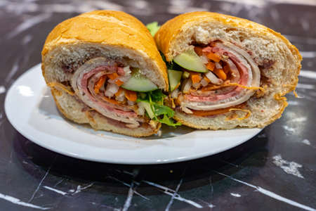 Close up photo of Vietnamese styled pork ham sandwich - Banh Miの写真素材
