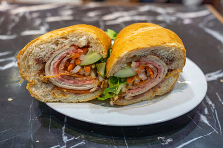 Vietnamese sandwich, common breakfast - Banh Mi stuffed with pork and vegetablesの写真素材