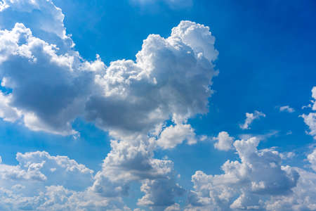 Natural cloudscape with blue sky background and cumulus cloudsの写真素材