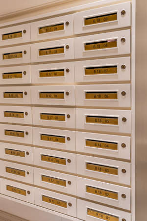 Rows of mailbox in lobby of residential condominium buildingの写真素材
