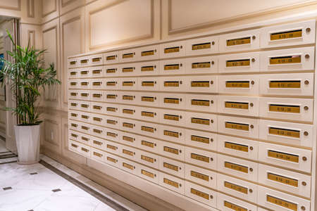 Letter mailbox array at elegant condominium entrance hallの写真素材
