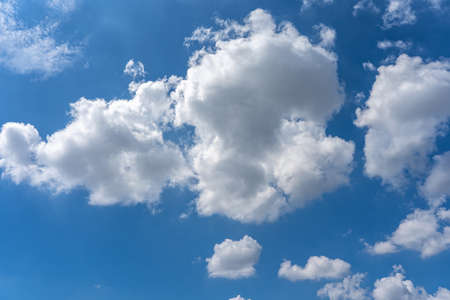 Big white cloud cumulus floating on the blue sky for backgrounds conceptの写真素材