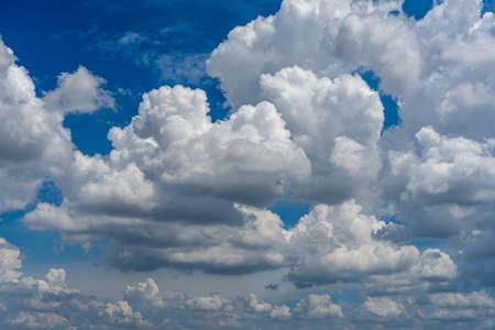 Beautiful cloudy sky background with white clouds floatingの写真素材