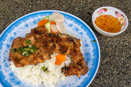 Vietnamese grilled pork chop and fried egg rice- Com Tamの写真素材